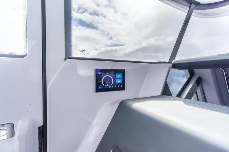 Slide: The Image of 2021 Axopar 37 XC interior with digital display and modern design. - 27