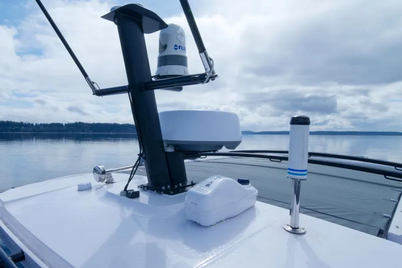 Slide: The Image of Axopar 37 XC 2021 boat radar and equipment on calm water. - 30