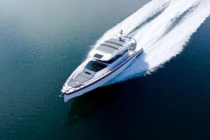 Slide: The Image of 2021 Axopar 37 XC cruising on open water, aerial view. - 35