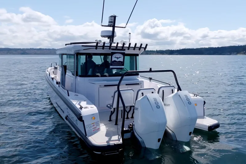 Slide: The Image of 2021 Axopar 37 XC boat with dual engines on open water. - 4