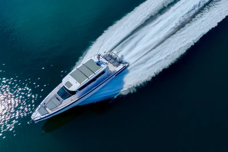 Slide: The Image of 2021 Axopar 37 XC cruising swiftly on open water. - 5