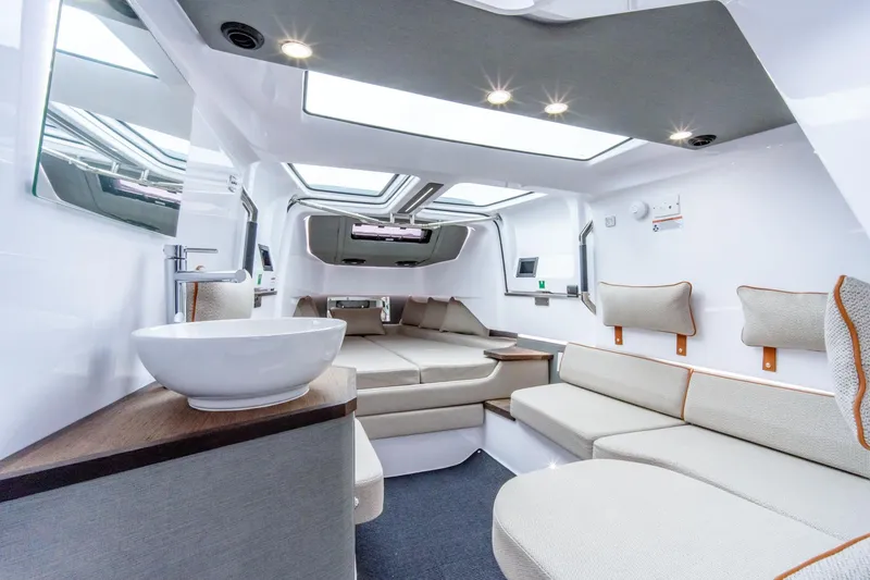 Slide: The Image of Luxurious interior of 2021 Axopar 37 XC boat with modern seating and skylights. - 7