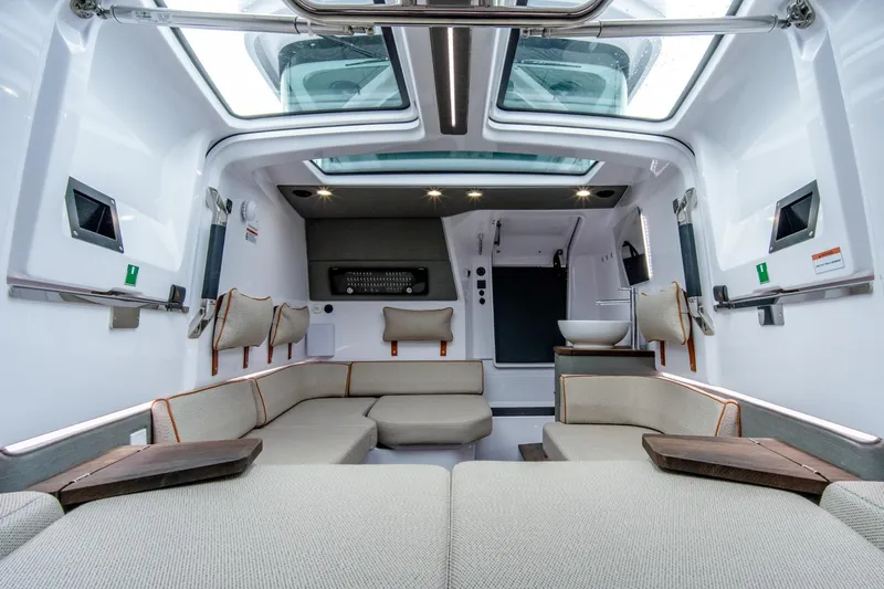 Slide: The Image of Luxurious interior of 2021 Axopar 37 XC boat with modern seating and skylights. - 8