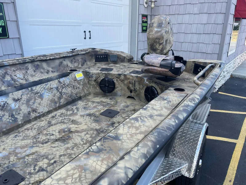 Slide: The Image of 2025 Excel 1751 River Warrior boat with camouflage design and trailer. - 10