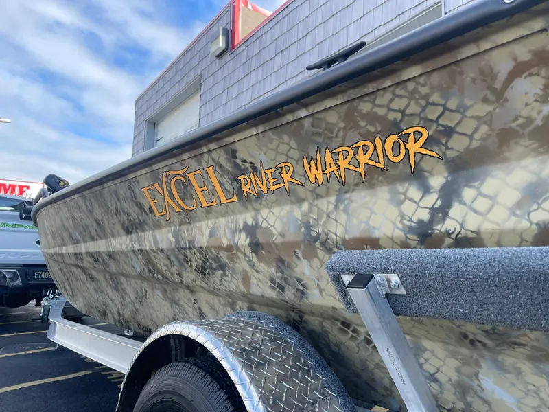 Slide: The Image of 2025 Excel 1751 River Warrior boat with camouflage design on trailer. - 12