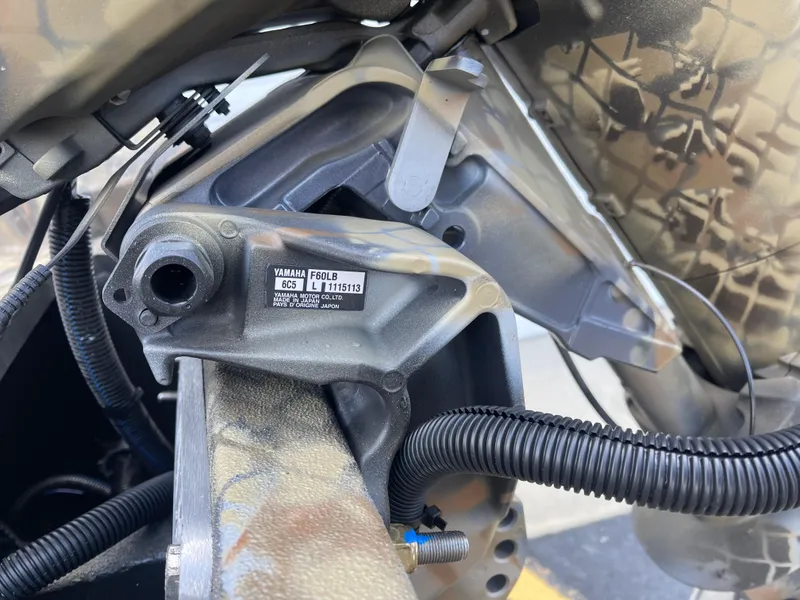 Slide: The Image of Close-up of 2025 Excel 1751 River Warrior engine component with camouflage design. - 13