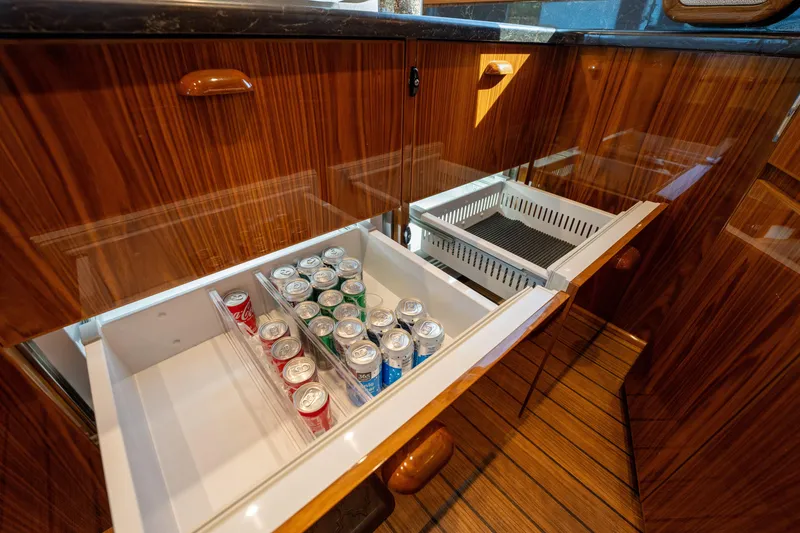 Slide: The Image of Luxury wooden cabinetry with beverage storage in 2022 Viking 54 Convertible yacht. - 15