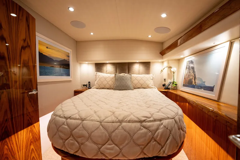 Slide: The Image of Luxurious bedroom interior of 2022 Viking 54 Convertible yacht with elegant decor. - 19