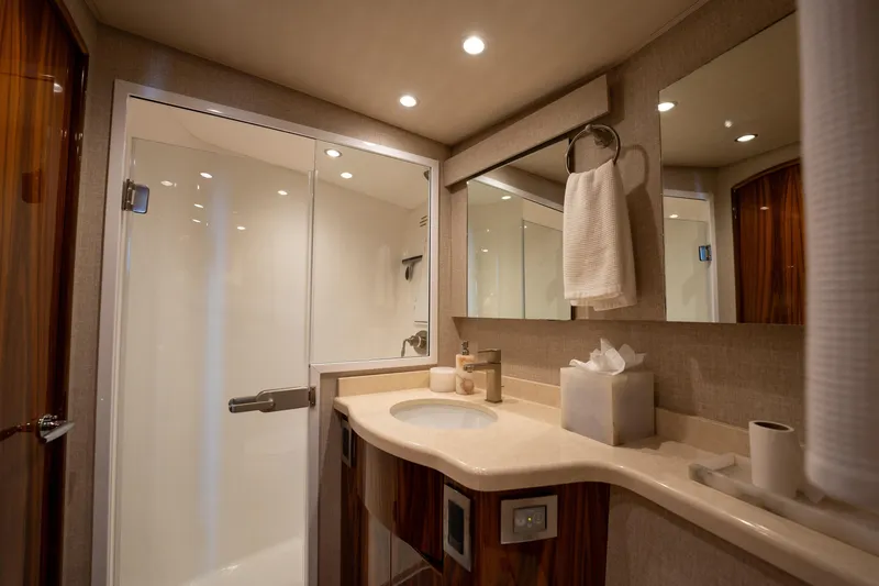 Slide: The Image of Luxurious bathroom in 2022 Viking 54 Convertible yacht with modern fixtures and elegant design. - 24