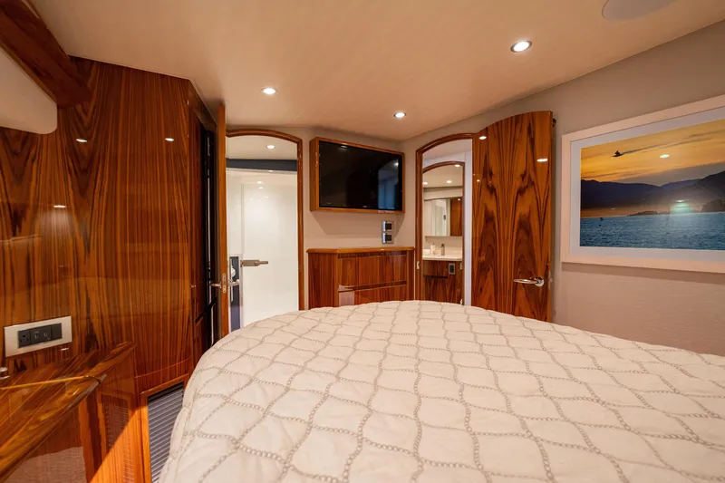 Slide: The Image of Luxurious interior of 2022 Viking 54 Convertible yacht with wood finishes and modern amenities. - 29