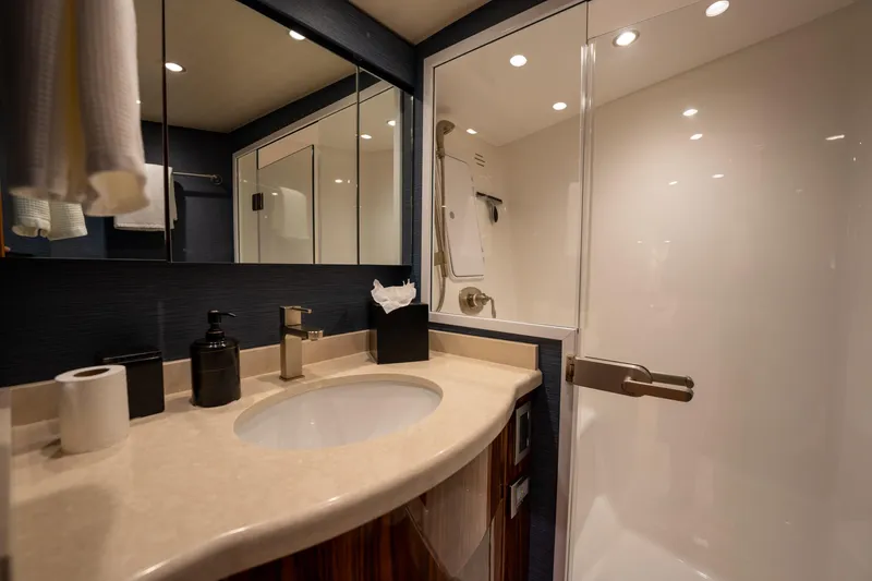 Slide: The Image of Luxurious bathroom in 2022 Viking 54 Convertible yacht with modern fixtures and spacious shower. - 30