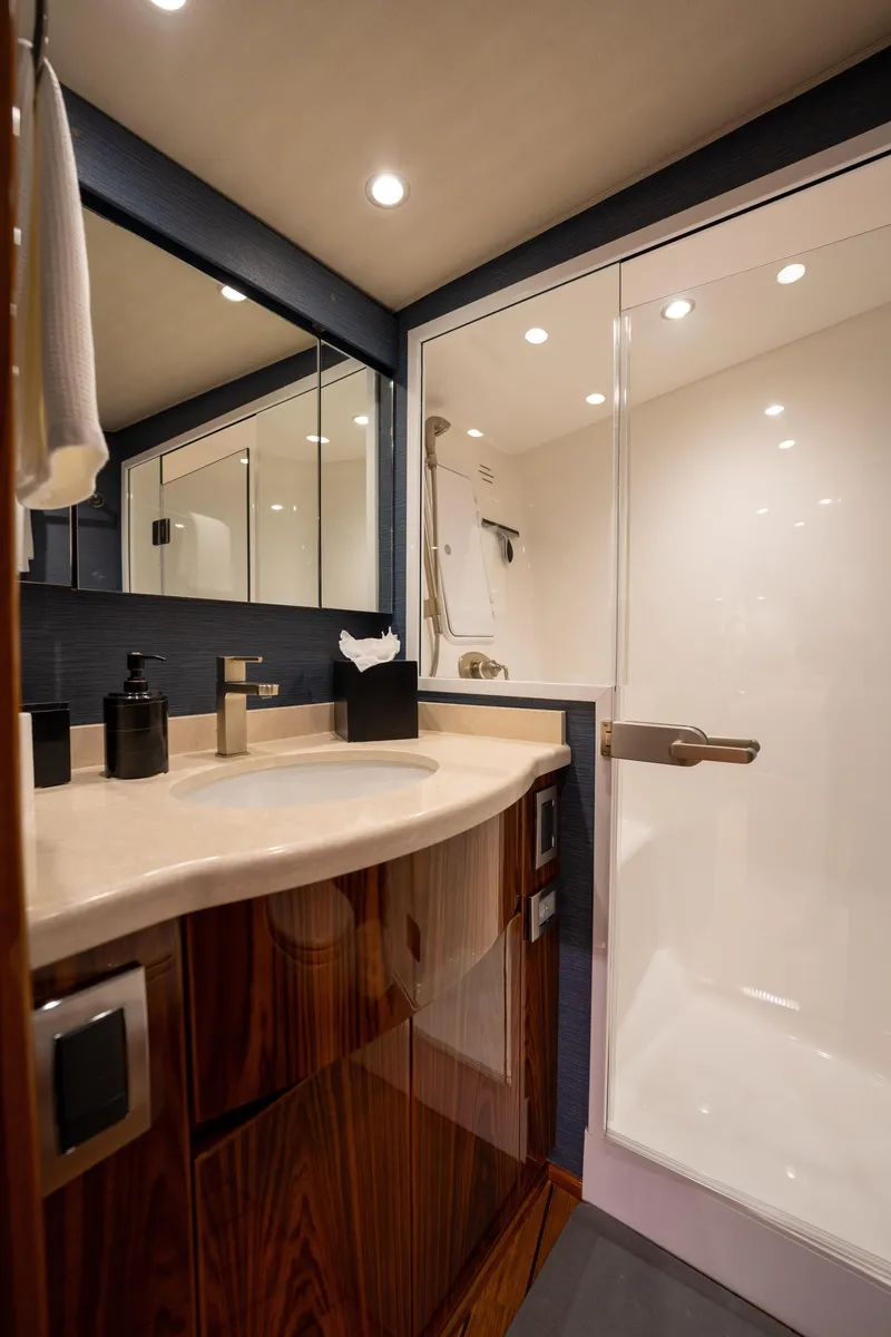 Slide: The Image of Luxurious bathroom in 2022 Viking 54 Convertible yacht with modern fixtures and elegant design. - 32