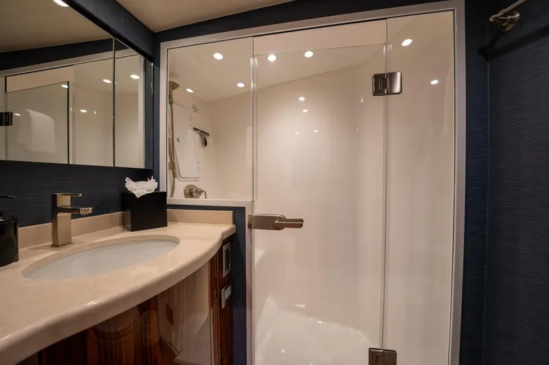Slide: The Image of Luxurious bathroom in 2022 Viking 54 Convertible yacht with glass shower and modern fixtures. - 33