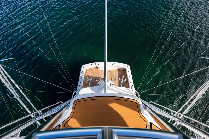 Slide: The Image of Aerial view of 2022 Viking 54 Convertible yacht over deep blue water. - 35
