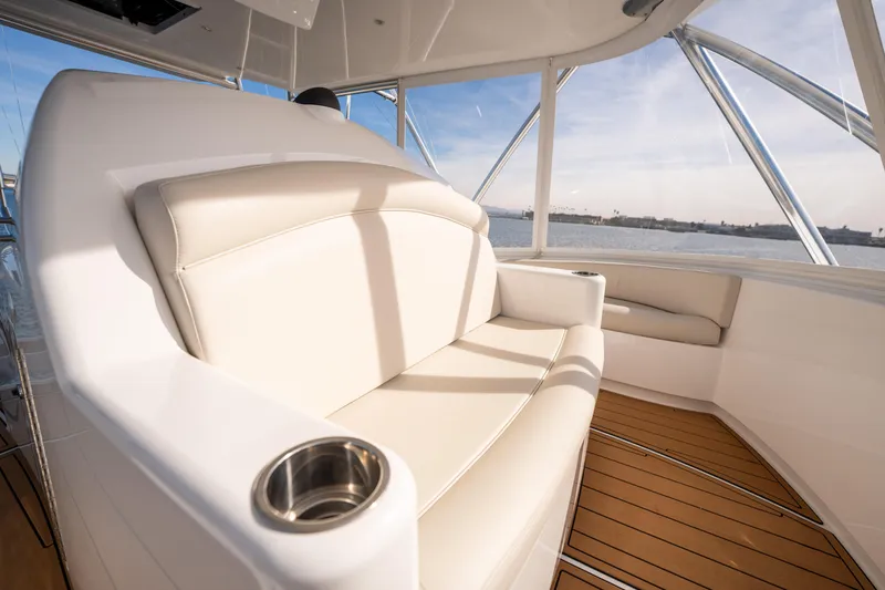 Slide: The Image of Luxurious seating on 2022 Viking 54 Convertible yacht with ocean view. - 43