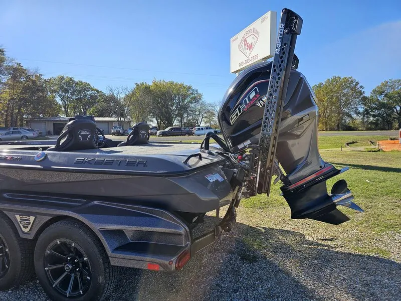 Slide: The Image of 2025 Skeeter FXR21L boat with powerful outboard motor on a trailer. - 3