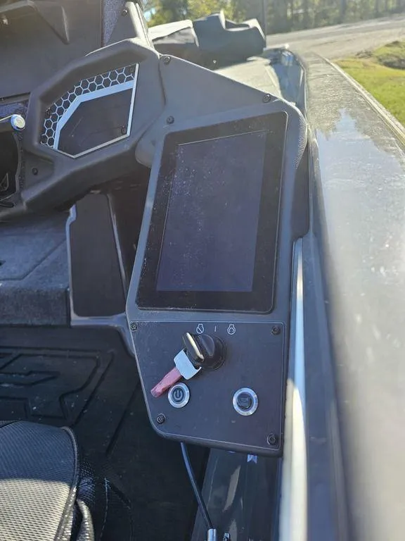 Slide: The Image of 2025 Skeeter FXR21L boat dashboard with touchscreen and ignition switch. - 5