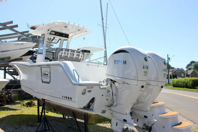 The Image of 2025 Sea Hunt Gamefish 27 boat with forward seating, dual Yamaha engines, and Garmin electronics. - 0