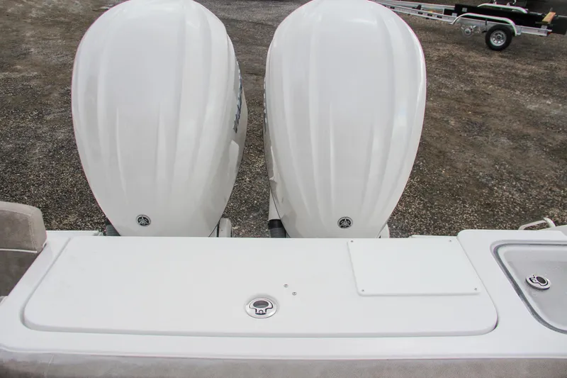 Slide: The Image of 2025 Sea Hunt Gamefish 27 boat interior with forward seating and dual engines. - 12