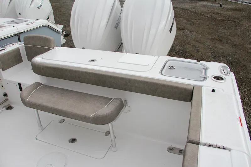 Slide: The Image of 2025 Sea Hunt Gamefish 27 boat with dual outboard engines, rear view. - 13
