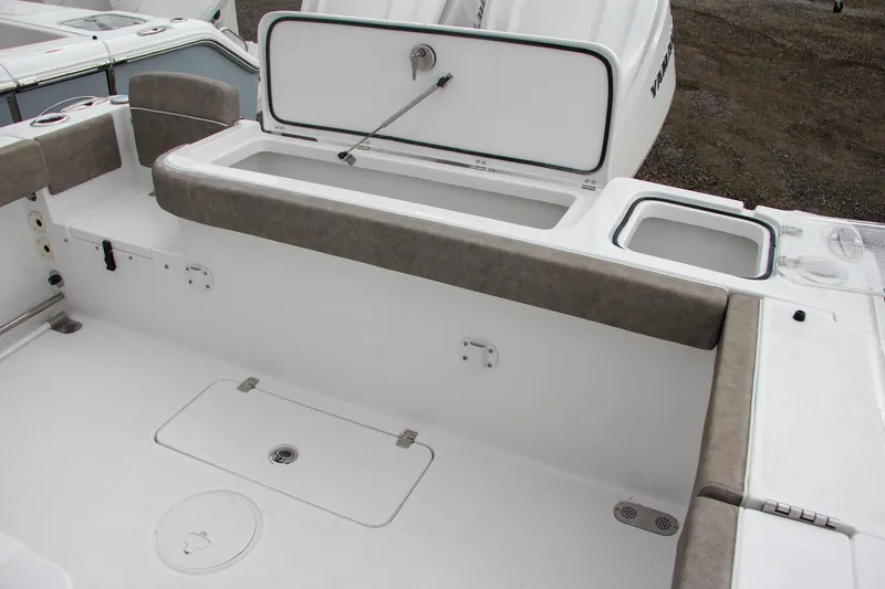 Slide: The Image of 2025 Sea Hunt Gamefish 27 boat interior with seating and storage. - 14