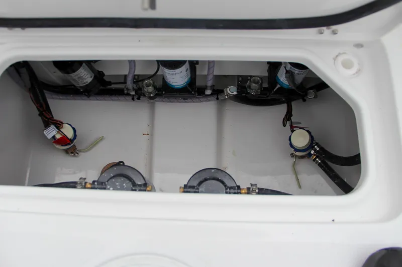 Slide: The Image of 2025 Sea Hunt Gamefish 27 Forward Seating deck with storage hatch. - 16