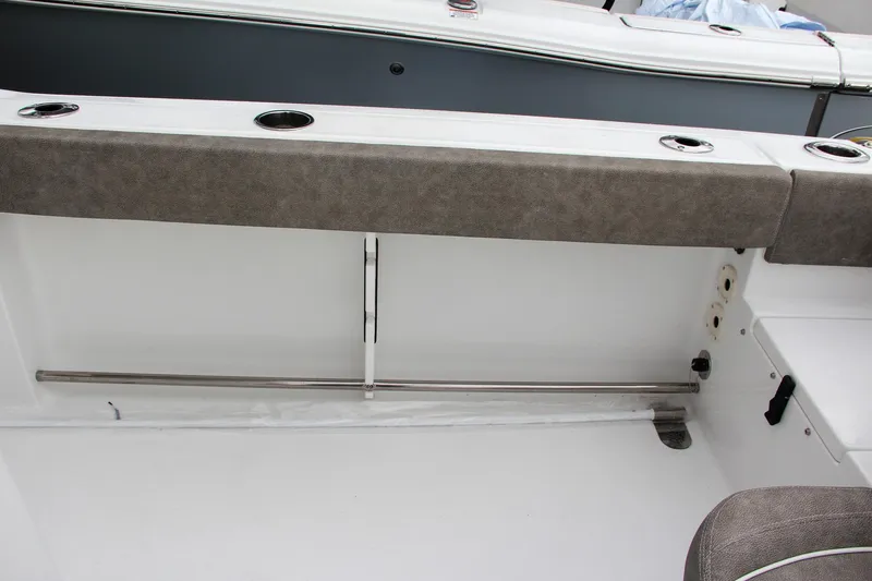 Slide: The Image of 2025 Sea Hunt Gamefish 27 Forward Seating boat compartment with pumps and wiring. - 17