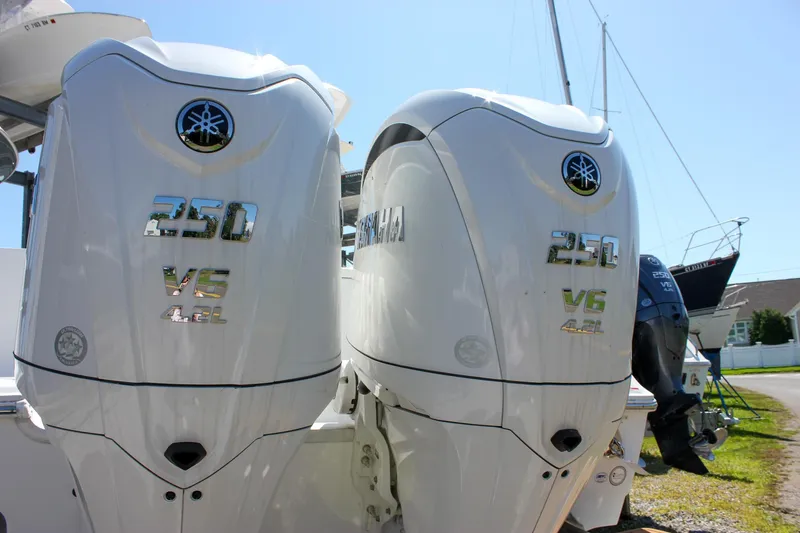 Slide: The Image of 2025 Sea Hunt Gamefish 27 Forward Seating interior detail with rod holders. - 18