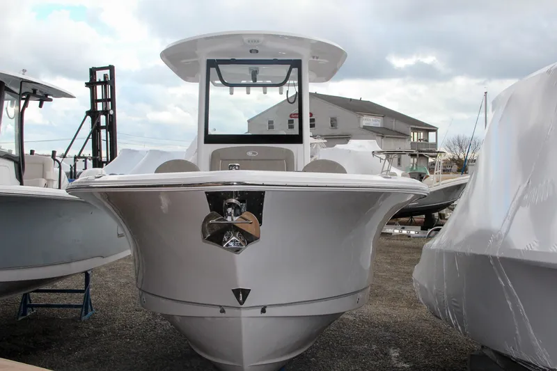 Slide: The Image of 2025 Sea Hunt Gamefish 27 with dual Yamaha engines, displayed outdoors on a sunny day. - 2