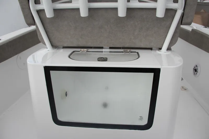 Slide: The Image of 2025 Sea Hunt Gamefish 27 boat interior with forward seating and logo detail. - 24