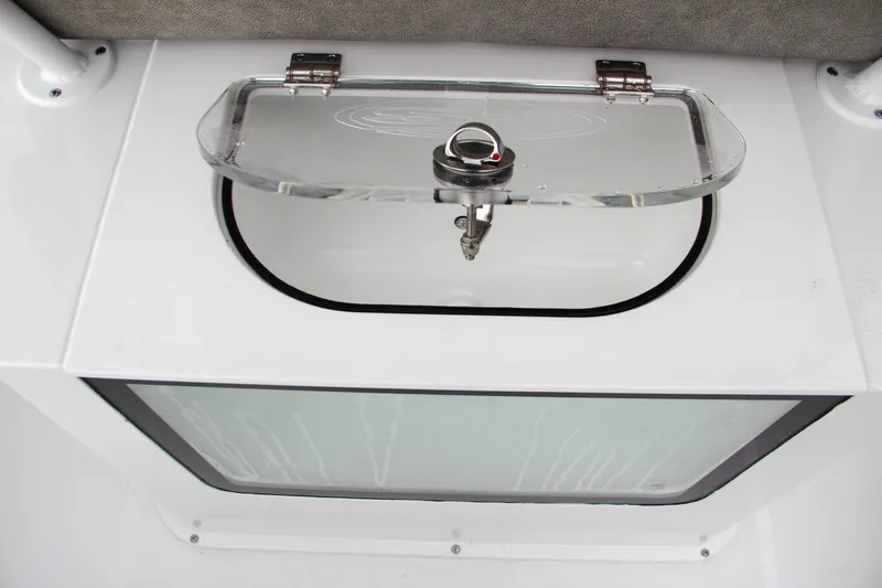 Slide: The Image of 2025 Sea Hunt Gamefish 27 Forward Seating boat interior with storage compartment. - 25