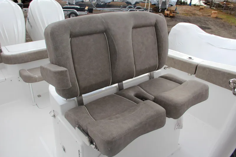 Slide: The Image of Sea Hunt Gamefish 27 boat interior, featuring storage compartment and hose, 2025 model. - 33