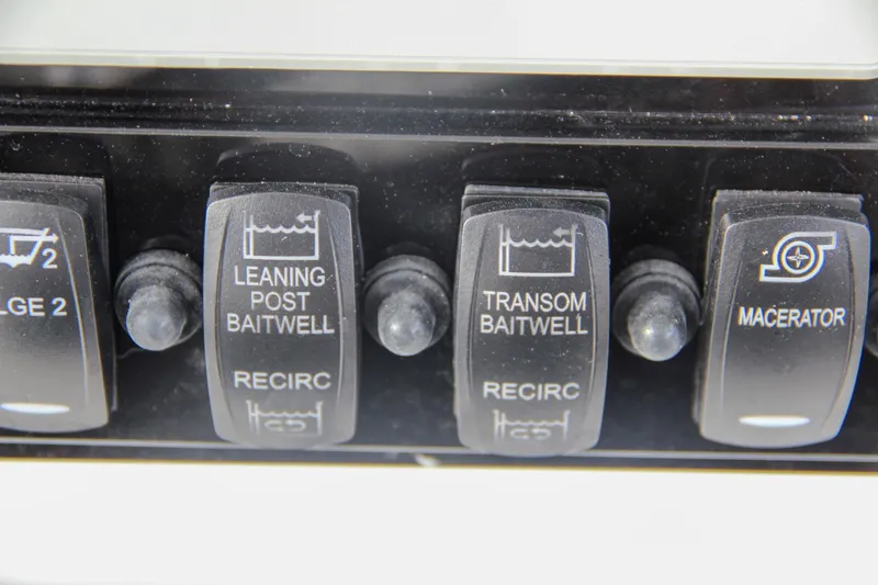 Slide: The Image of Dashboard of 2025 Sea Hunt Gamefish 27 with dual Garmin displays and control switches. - 40