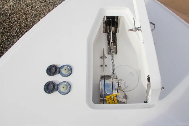 Slide: The Image of 2025 Sea Hunt Gamefish 27 Forward Seating boat deck, featuring storage hatch and seating area. - 46