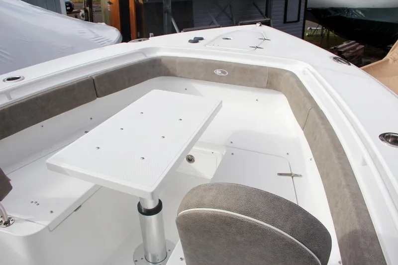 Slide: The Image of 2025 Sea Hunt Gamefish 27 Forward Seating with table and cushioned seats. - 50