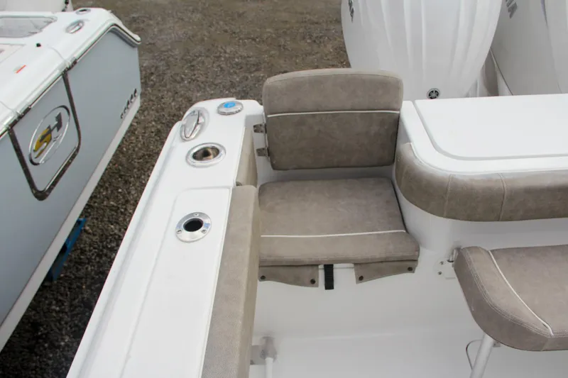 Slide: The Image of 2025 Sea Hunt Gamefish 27 Forward Seating with table and cushioned seating area. - 51