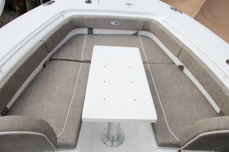 Slide: The Image of 2025 Sea Hunt Gamefish 27 Forward Seating with table and cushioned seats. - 53