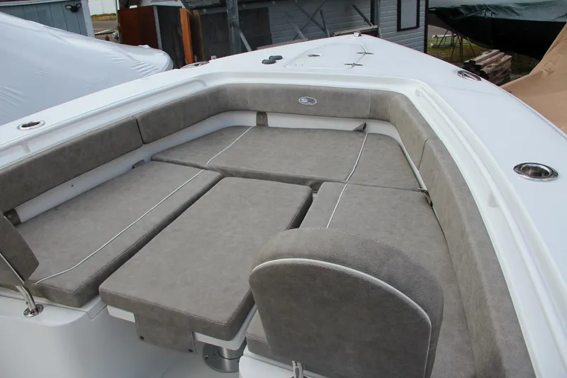Slide: The Image of 2025 Sea Hunt Gamefish 27 Forward Seating with cushioned seating and table. - 54