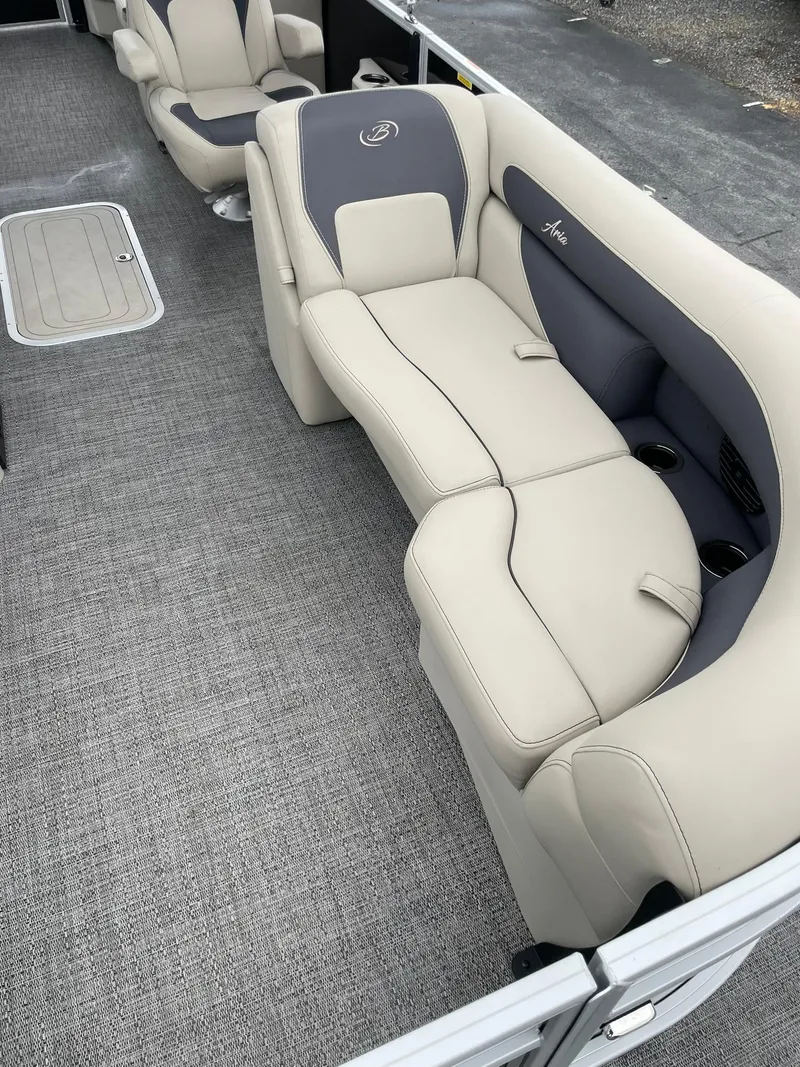 Slide: The Image of 2024 Barletta ARIA 22QC boat interior with beige and gray seating. - 13