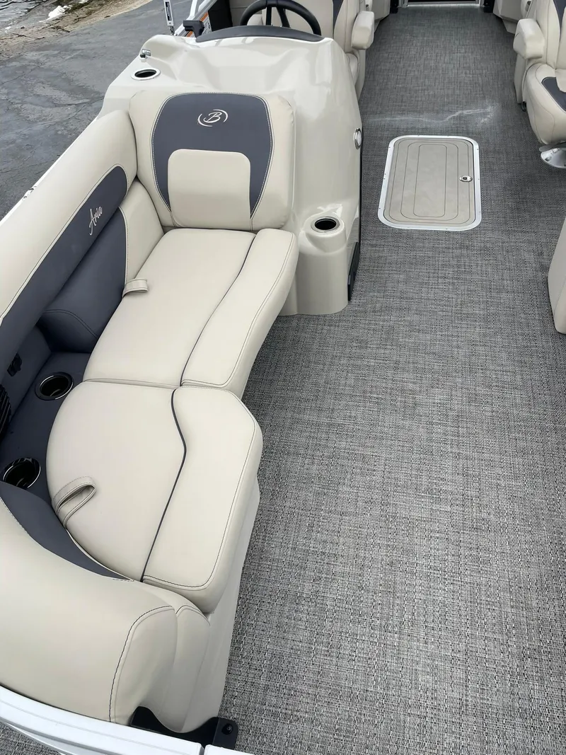 Slide: The Image of 2024 Barletta ARIA 22QC boat interior with beige seating and gray carpet. - 14