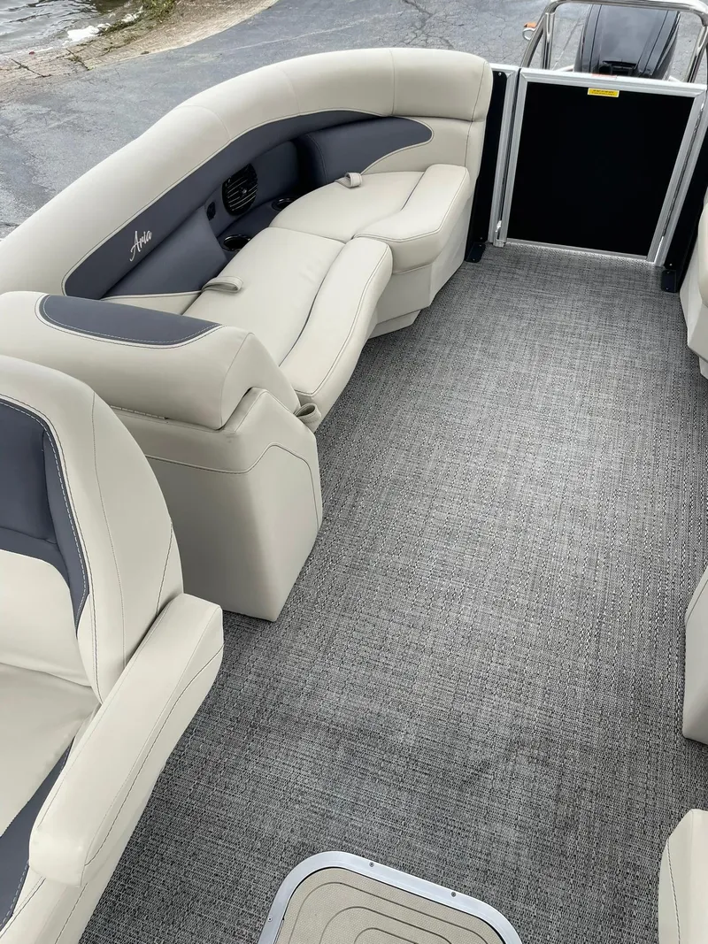Slide: The Image of 2024 Barletta ARIA 22QC pontoon boat interior with plush seating and carpeted flooring. - 17