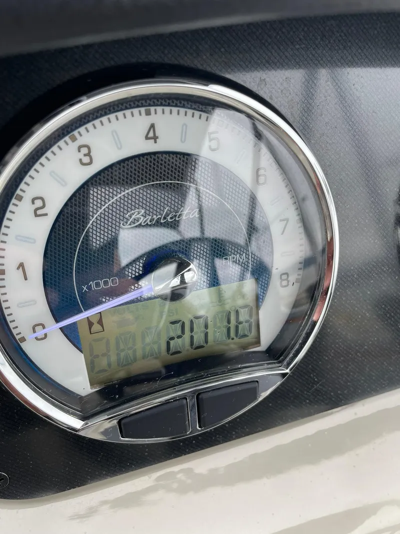 Slide: The Image of Close-up of 2024 Barletta ARIA 22QC speedometer displaying 201.8 hours. - 21