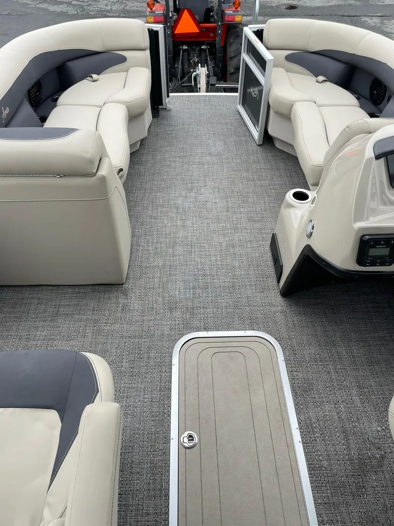 Slide: The Image of 2024 Barletta ARIA 22QC pontoon boat interior with plush seating and modern design. - 25