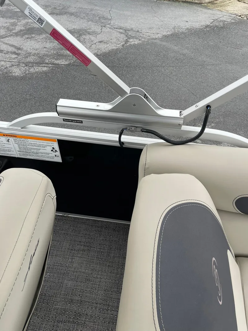 Slide: The Image of 2024 Barletta ARIA 22QC boat interior with beige seating and gray flooring. - 26