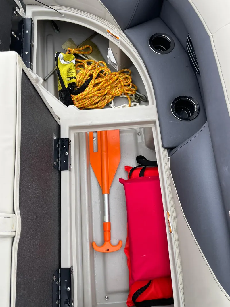 Slide: The Image of Storage compartment in 2024 Barletta ARIA 22QC with safety gear and accessories. - 30