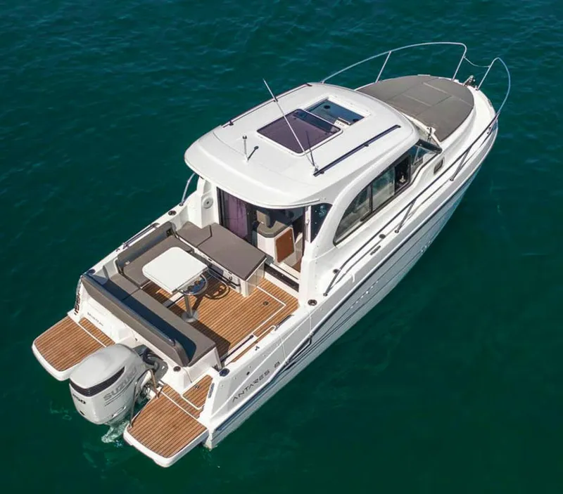 Slide: The Image of 2023 Beneteau Antares 8 boat on water, aerial view, showcasing deck and seating area. - 2