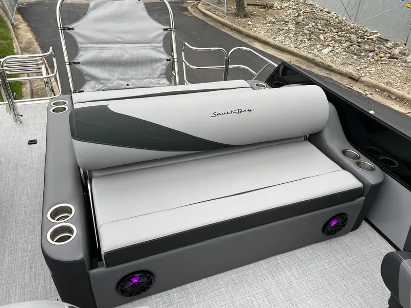 Slide: The Image of 2025 South Bay S224 UL boat interior with gray seating and cup holders. - 13