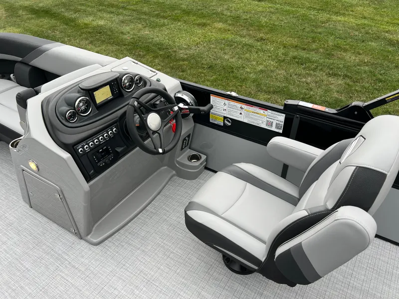 Slide: The Image of 2025 South Bay S224 UL boat interior with modern dashboard and comfortable seating. - 21