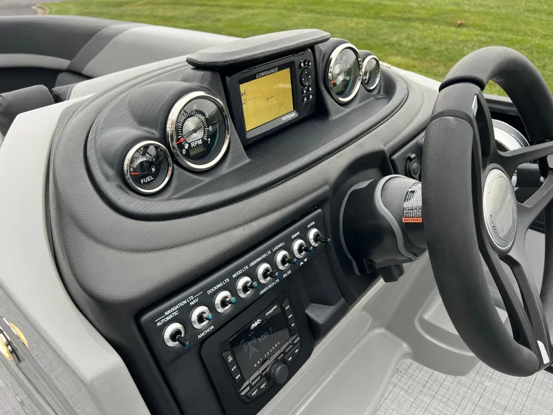 Slide: The Image of 2025 South Bay S224 UL boat dashboard with gauges and controls. - 23