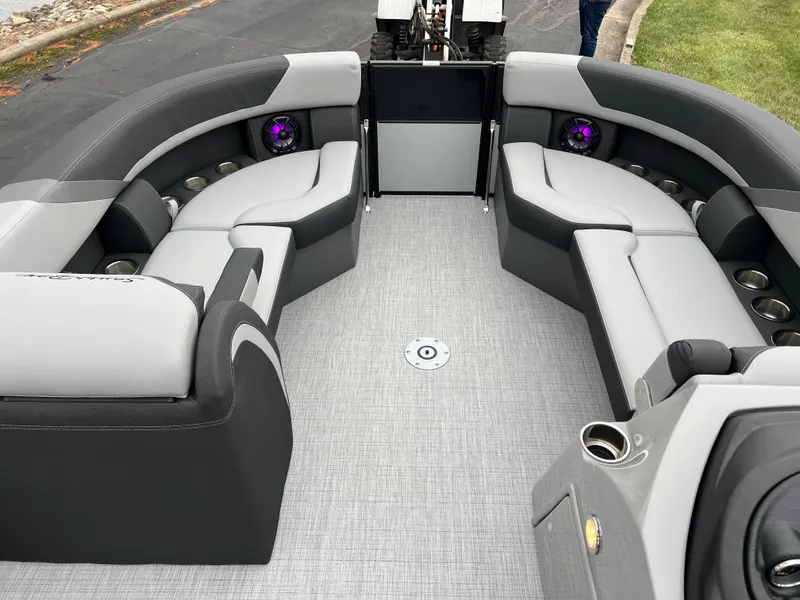 Slide: The Image of 2025 South Bay S224 UL pontoon boat interior with gray seating and modern design. - 25